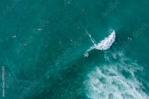 Top down drone photo of surfers in Hawaii