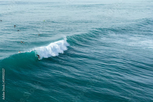 Surfer rides a barrel on a wave in Honolulu, Hawaii