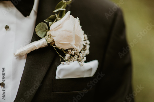 Принти на полотні Pinned white rose wedding boutonnière with baby's breath