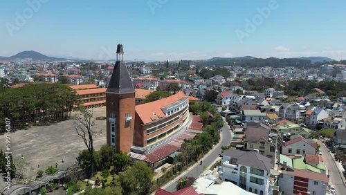 Rotating drone footage above the old architecture of Yersin school in Dalat, Vietnam. Camera is moving from left to the right. photo