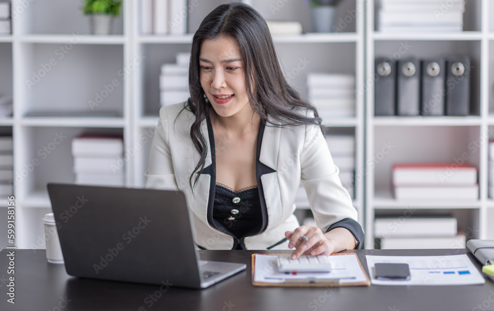 Financial Business asian women analyze the graph of the company's performance to create profits and growth, Market research reports and income statistics, Financial and Accounting concept. Financial Business asian women analyze the graph of the company's performance to create profits and growth, Market research reports and income statistics, Financial and Accounting concept.