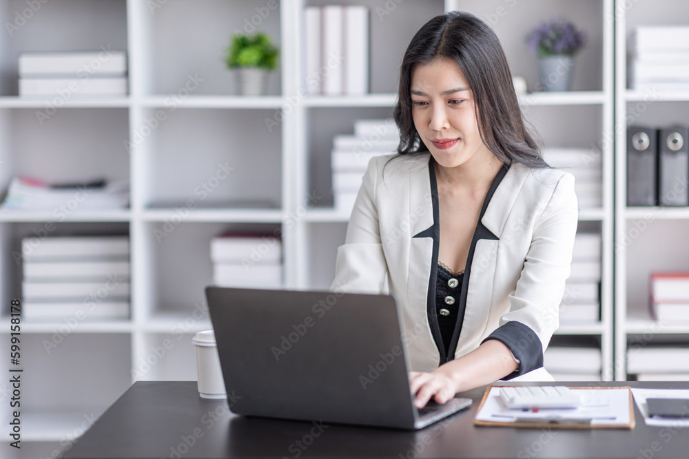 Financial Business asian women analyze the graph of the company's performance to create profits and growth, Market research reports and income statistics, Financial and Accounting concept. Financial Business asian women analyze the graph of the company's performance to create profits and growth, Market research reports and income statistics, Financial and Accounting concept.