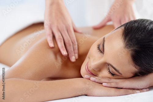 Happy, luxury and woman with massage, self care and stress relief with salon treatment, grooming and wellness. Female person, client and lady with skincare, relax and health with peace at a resort