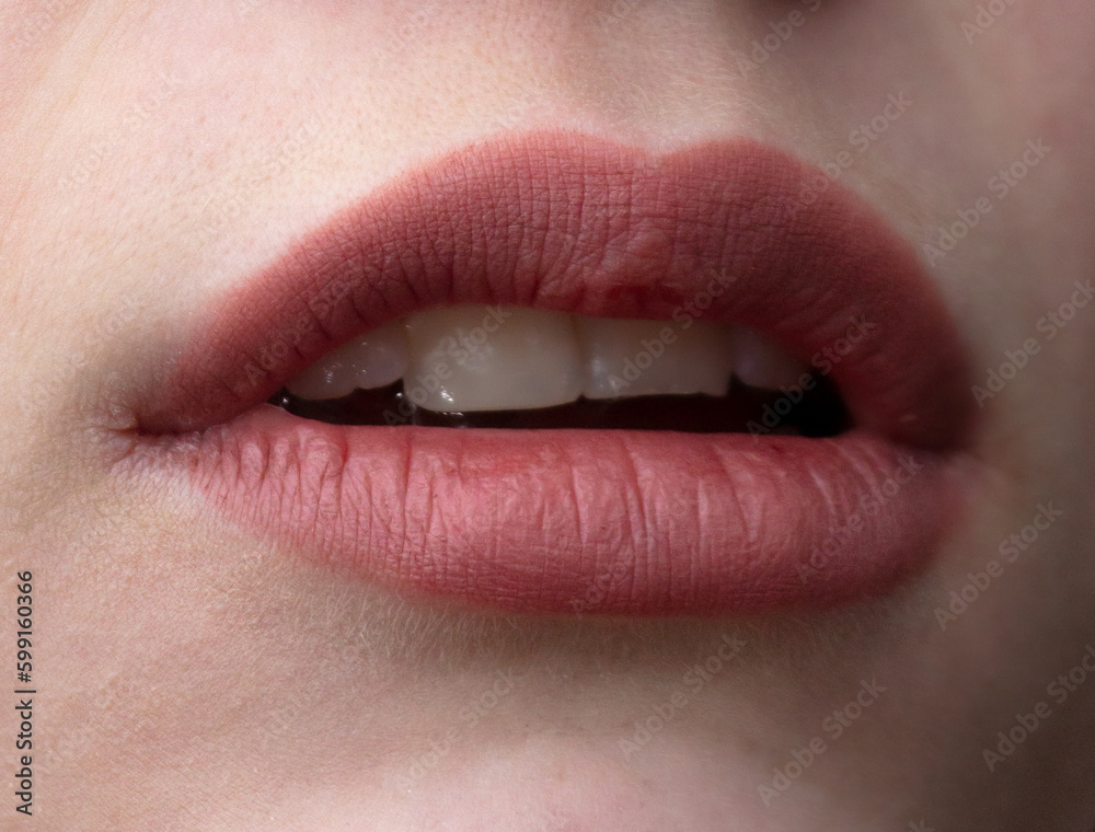 Fototapeta premium Beautiful lips of a girl close-up