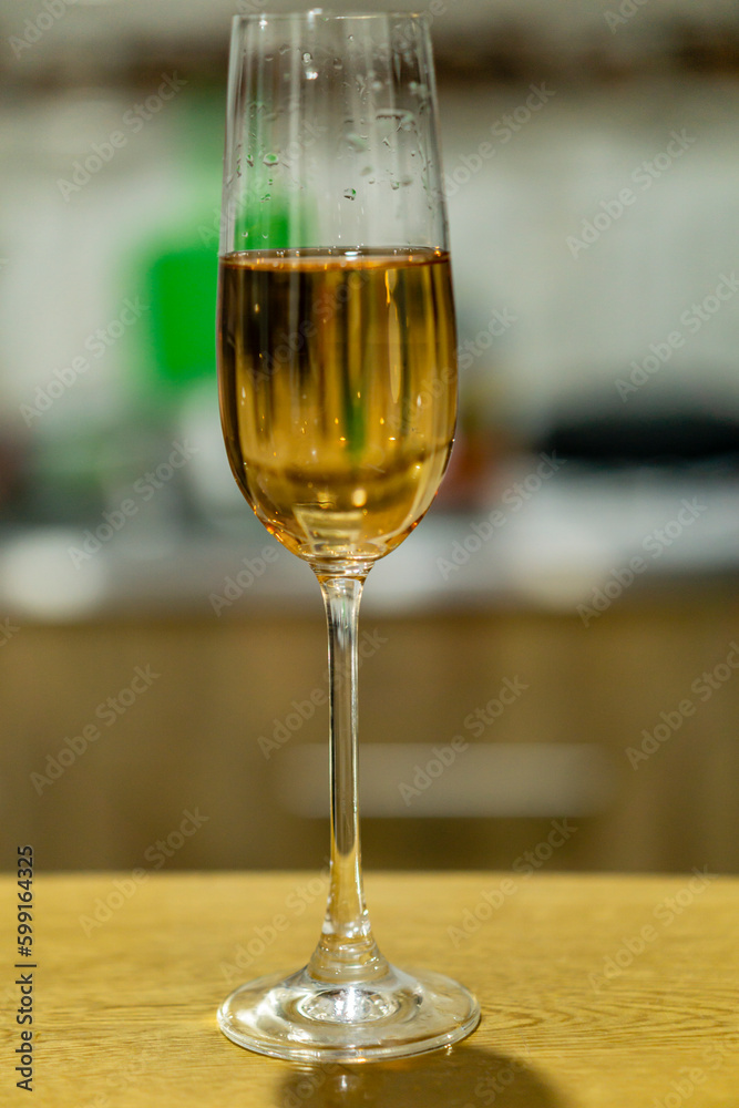 Obraz premium glass of white wine held by a woman