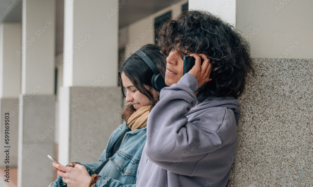 teenagers with mobile phone outside
