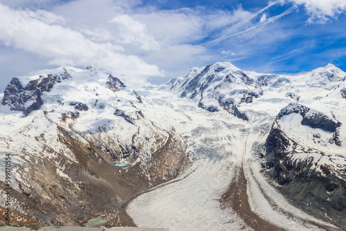 Magnificent panorama of the Pennine Alps with famous Gorner Glacier and impressive snow capped mountains Monte Rosa Massif close to Zermatt, Switzerland