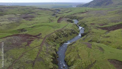 Wallpaper Mural Aerial high above the terrain of the famous natural landmark and tourist attraction of Skogafoss falls and Fimmvorduhals trail in Iceland. Drone dolly forward shot Torontodigital.ca