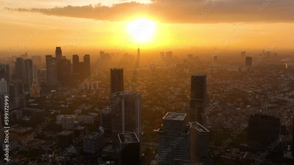 Jakarta with modern buildings at sunset view from above. Urban landscape. Indonesia. Jakarta with modern buildings at sunset view from above. Urban landscape. Indonesia.