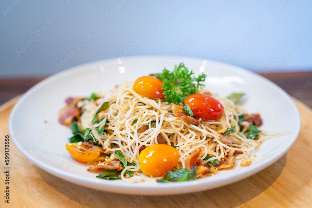 stir fried Spaghetti with bacon serve with tomato stir fried Spaghetti with bacon serve with tomato