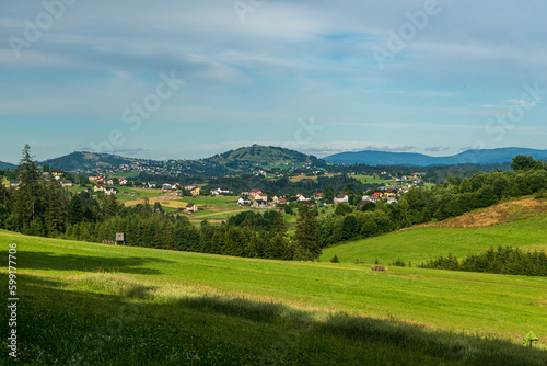 Fototapeta Naklejka Na Ścianę i Meble -  Jaworzynka village with hills on the background in Beskid mountains in Poland