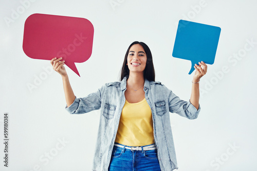 Every opinion matters. Studio shot of an attractive young woman holding speech bubbles.