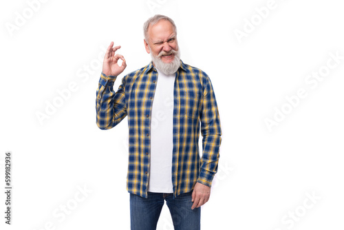 handsome elderly gray-haired retired man with a mustache and beard in a shirt