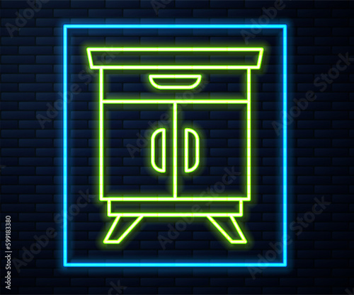 Glowing neon line Furniture nightstand icon isolated on brick wall background. Vector