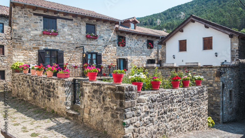 Houses with flowers in the pretty village of Roncal, Valle de Roncal, Comunidad Foral de Navarra, Spain photo