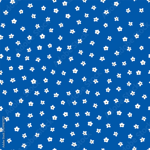 Blue seamless pattern with white tiny flowers