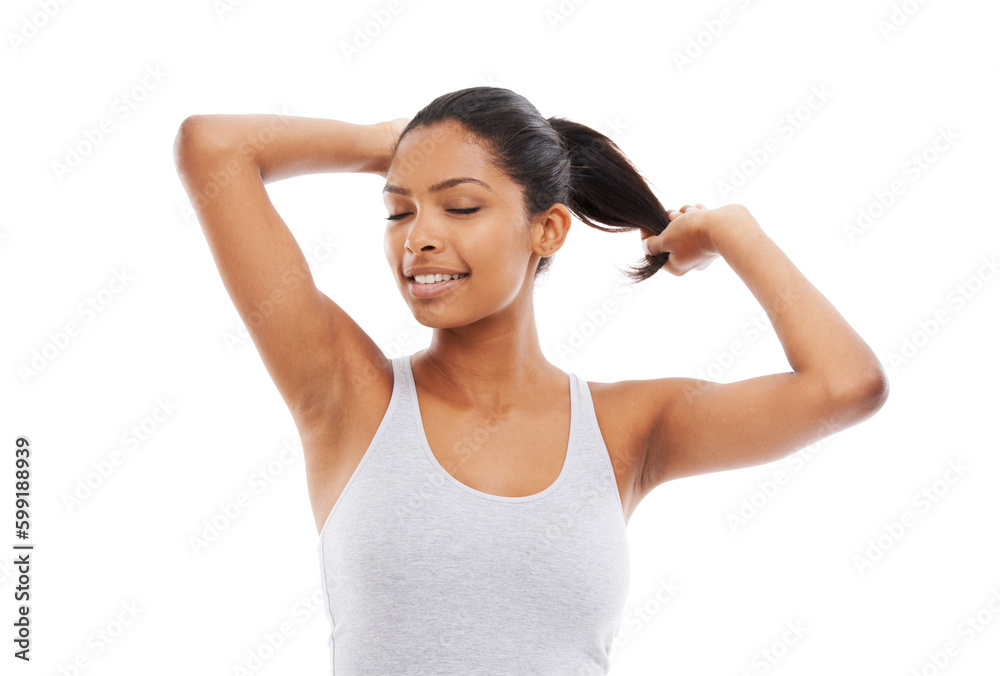Enjoying the feeling of luxurious hair. A gorgeous young woman in gym clothes touching her hair. Enjoying the feeling of luxurious hair. A gorgeous young woman in gym clothes touching her hair.