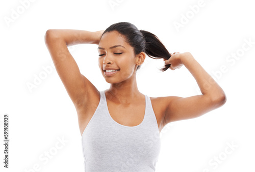Enjoying the feeling of luxurious hair. A gorgeous young woman in gym clothes touching her hair.