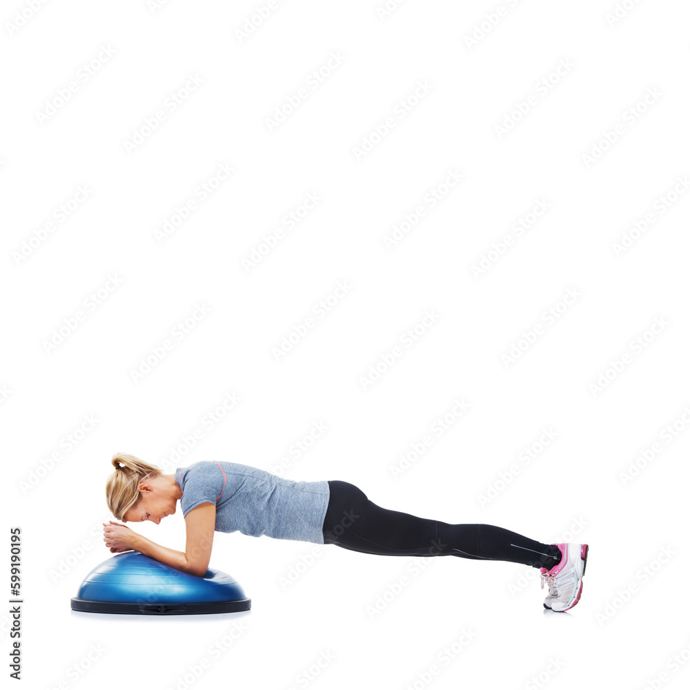She enjoys her workouts. An attractive young woman using a bosu-ball for an upper body workout. She enjoys her workouts. An attractive young woman using a bosu-ball for an upper body workout.