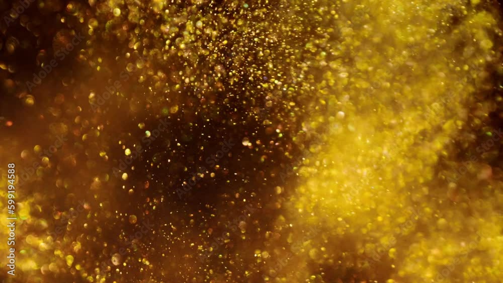 Majic Spark. Beautiful Patterns of Glowing Golden Particles in Motion