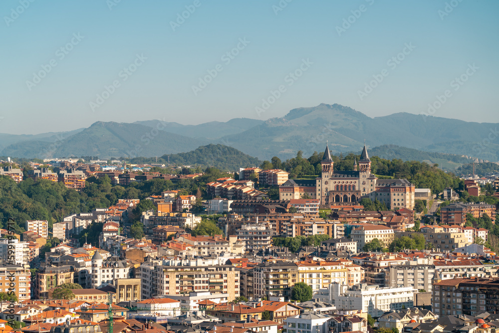 San Sebastian, SPAIN - July 09 2022: High angle view of San Sebastian - Donostia City. Travel destination in north of Spain in Vesque Country. View of city center. In background hills and mountains.