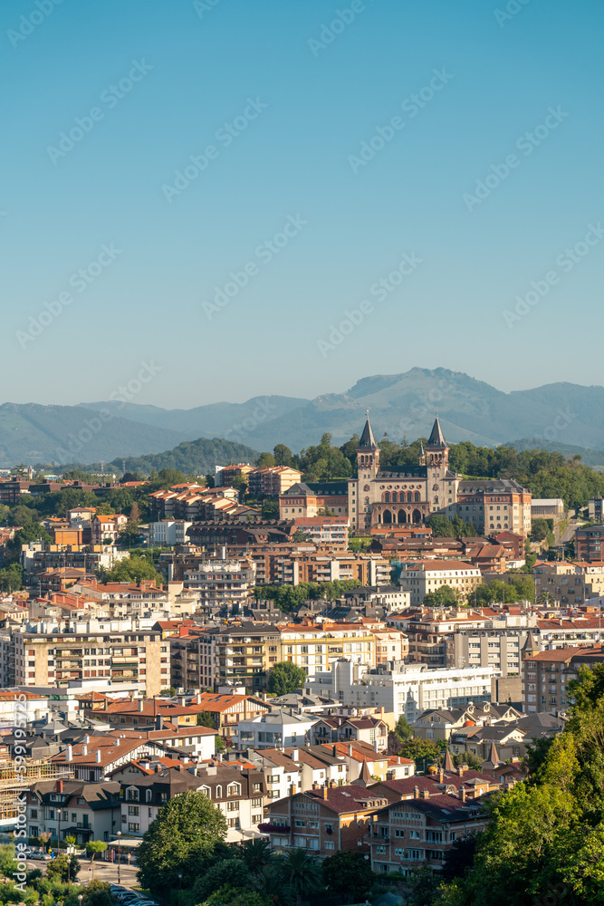 San Sebastian, SPAIN - July 09 2022: High angle view of San Sebastian - Donostia City. Travel destination in north of Spain in Vesque Country. View of city center. In background hills and mountains.