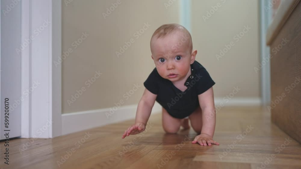 baby son crawling. happy family a first steps kid dream concept. baby newborn crawling down the hallway in the house. happy lifestyle baby boy crawling on the floor takes her first steps baby son crawling. happy family a first steps kid dream concept. baby newborn crawling down the hallway in the house. happy lifestyle baby boy crawling on the floor takes her first steps
