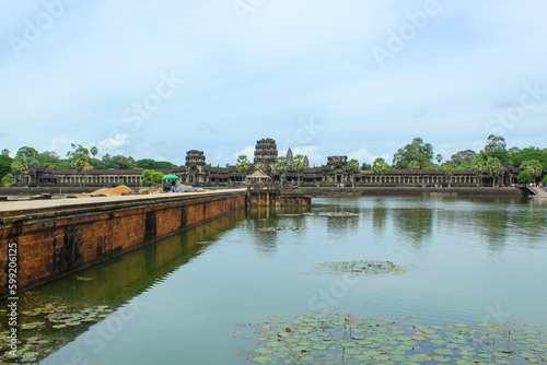 SIEM REAP, CAMBODIA. August 7th, 2019: Stone Bridge At Large Towers At Angkor Wat Temple Complex. Angkor Wat Is A Temple Complex In Cambodia And Is The Largest Religious Monument In The World.