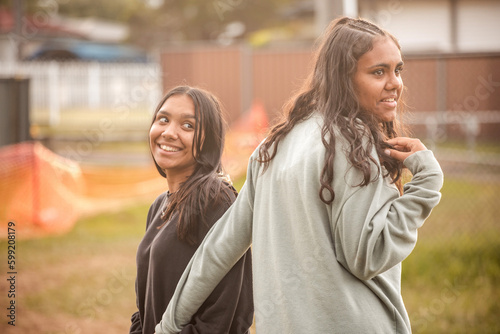 Two Aboriginal girls together outside photo