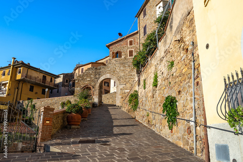 Fototapeta Naklejka Na Ścianę i Meble -  Porta Pisana gate in the medieval walls of Scarlino built in the 11th century, province of Grosseto, Tuscany region, Italy