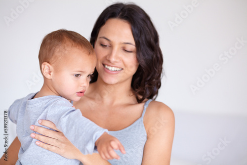 Just me and my baby. a beautiful young woman and her baby at home.