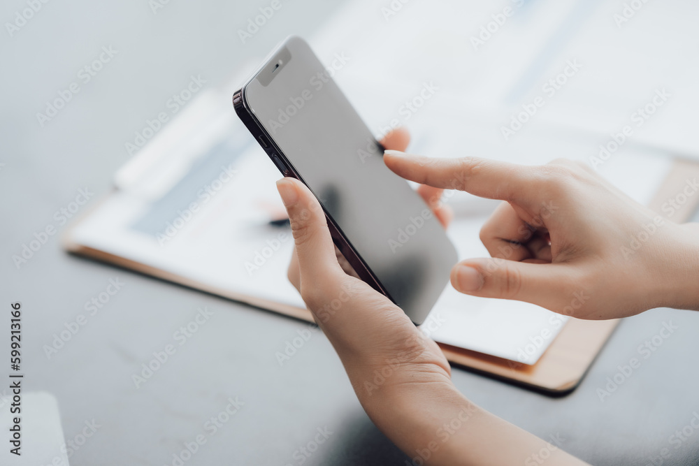 businessman or accountant hand working on calculator to calculate business data, accounting document and laptop computer at office, business concept businessman or accountant hand working on calculator to calculate business data, accounting document and laptop computer at office, business concept