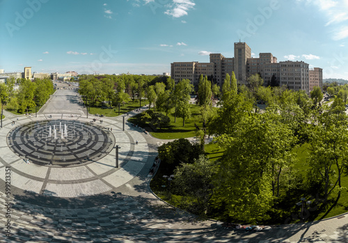 Spring aerial panorama view on Karazin National University main building on Freedom (Svobody) Square with modern fountain and green park. Kharkiv, Ukraine photo