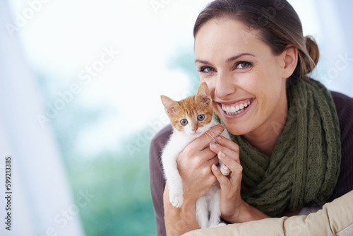 My little furry friend. Portrait of an attractive young woman and her adorable kitten.