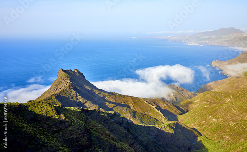 View from the scenic route Sendero Arena Blanca, Artenara, Gran Canaria. Nature and landscape with mountains of volcanic formation along the route of Sendero Arena Blanca to Mirador de Tirma. photo