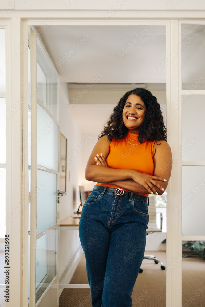 Happy female entrepreneur smiling at the camera Happy female entrepreneur smiling at the camera
