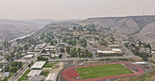 Maupin Oregon Aerial v3 cinematic panning view, drone flyover tranquil rural town by the Deschutes river, capturing barren canyon landscape on a hazy day - Shot with Mavic 3 Cine - August 2022 photo