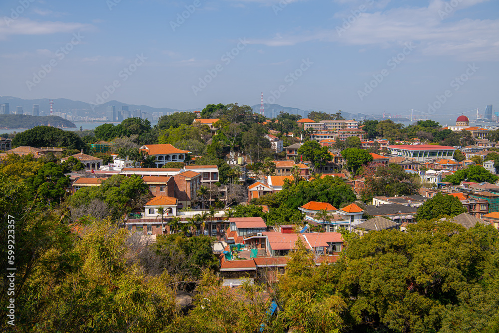 Close up on the roofs of the old historical buildings of Gulangyu Island, Xiamen City, Fujian Province, China. Blue sky with copy space for text, wallpaper