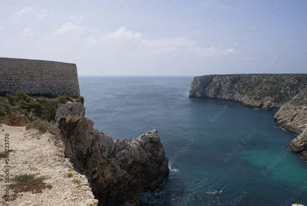 Wonderful landscapes in Portugal. Scenic coastline in Sagres. Fort of Santo Antonio de Belixe view from the cliff. Wavy sea. Rocky skerries. Sunny spring day. Selective focus