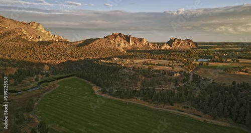 Terrebonne Oregon Aerial v60 flyover Sherwood Canyon along Crooked river capturing beautiful ranch mansions surrounded by vast farmlands with Smith Rock views - Shot with Mavic 3 Cine - August 2022 photo