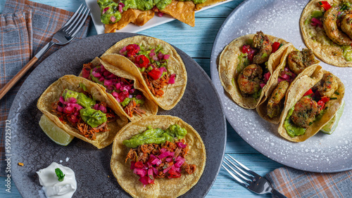Mexican food, dishes of tacos and nachos.