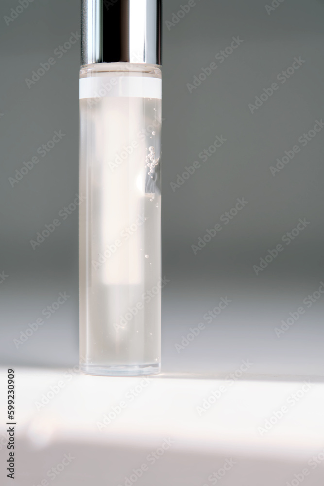 A pack of brow gel or clear lip gel in a pack with a brush.