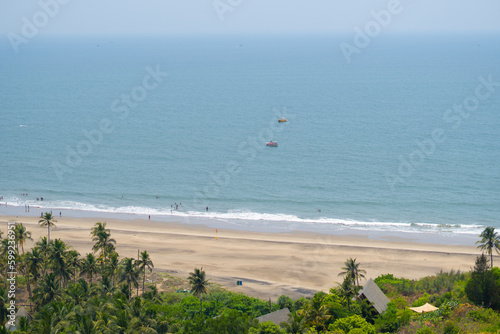 Wide angle shot of Vagator beach as seen from the top of the Chapora Fort at Goa in India. Wide angle shot of beach as seen from above. Blue sea in goa. Summer relaxation background. 