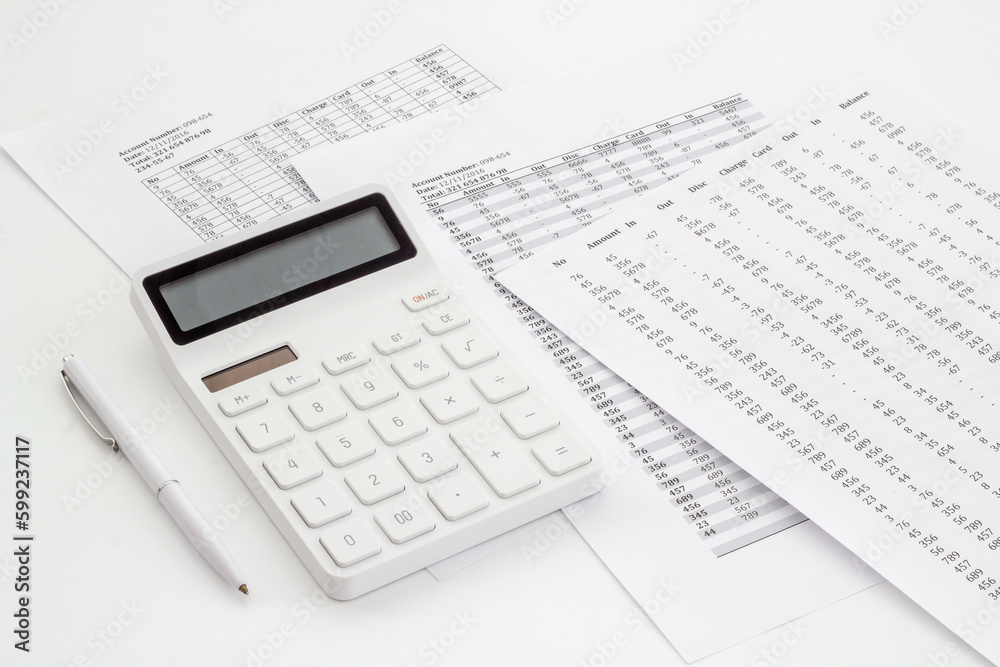 Financial business report preparing with calculator on office table Financial business report preparing with calculator on office table
