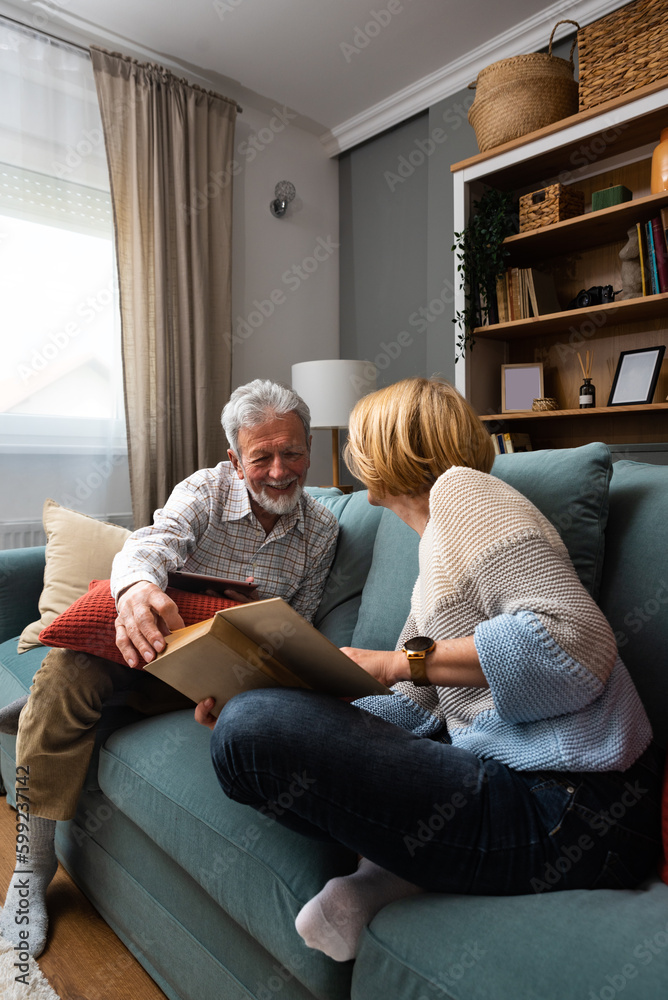 Simple living. Happy middleaged senior couple 70s husband and wife sit