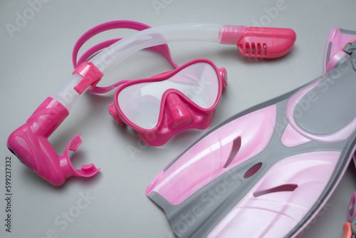 Children's pink snorkeling equipment, mask, snorkel and fins.