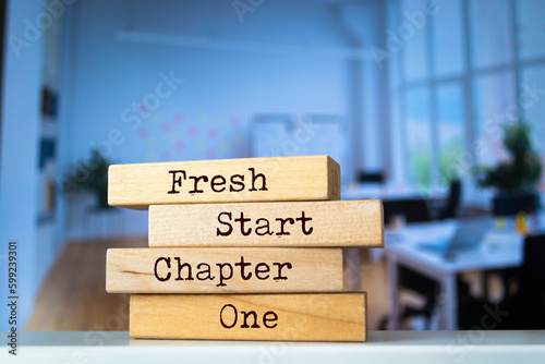 Wooden blocks with words 'Fresh Start Chapter One'.
