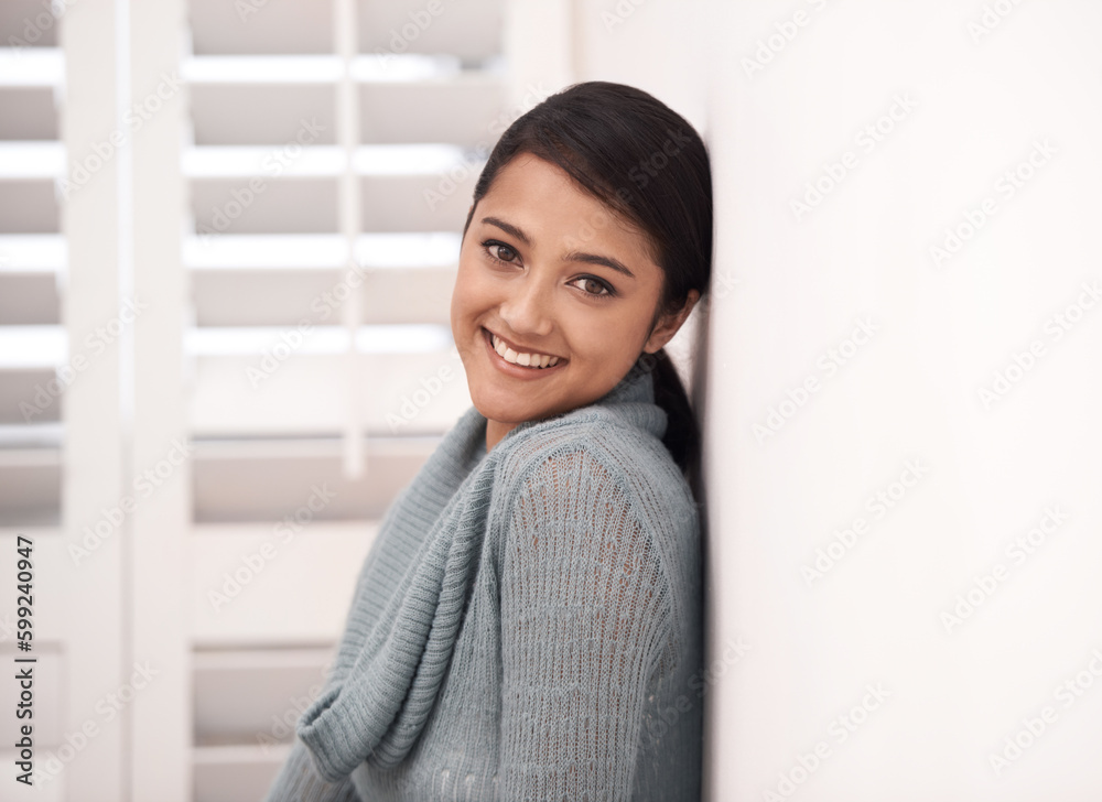What a brilliant smile. Portrait of an attractive young woman standing in her home. What a brilliant smile. Portrait of an attractive young woman standing in her home.