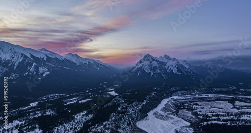 aerial hyper lapse of canadian rockie mountains over abraham lake towards William Booth and Stan Waters Peaks during sunrise photo