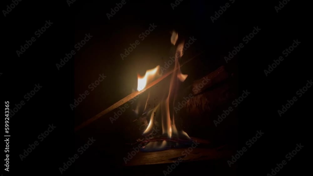 View of burning wood at night in a fireplace View of burning wood at night in a fireplace